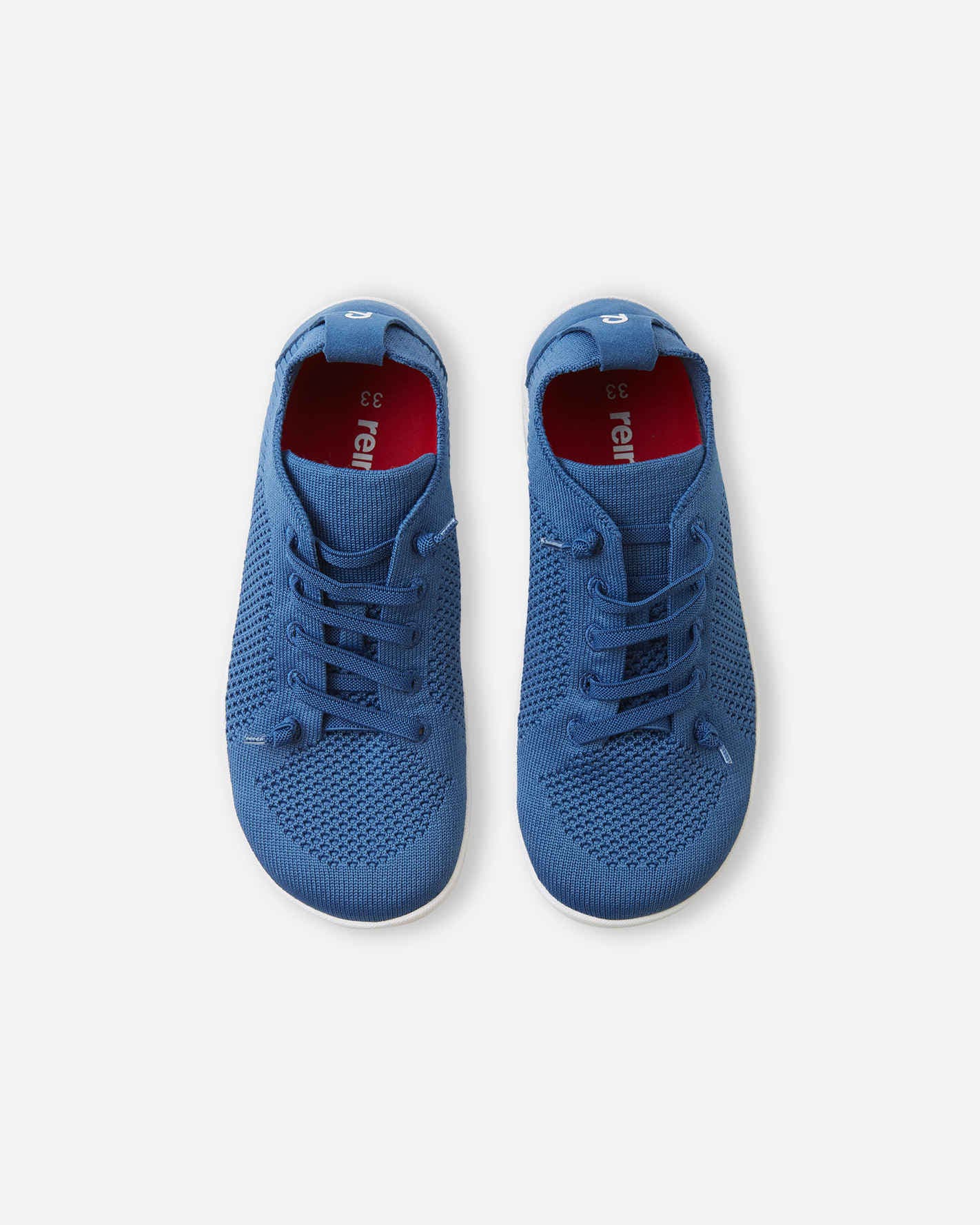 Blue knit sneakers with lace-up design and breathable mesh upper, top-down view
