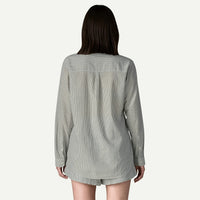 Women's striped button-down shirt shown from behind, long sleeves with cuffed wrists