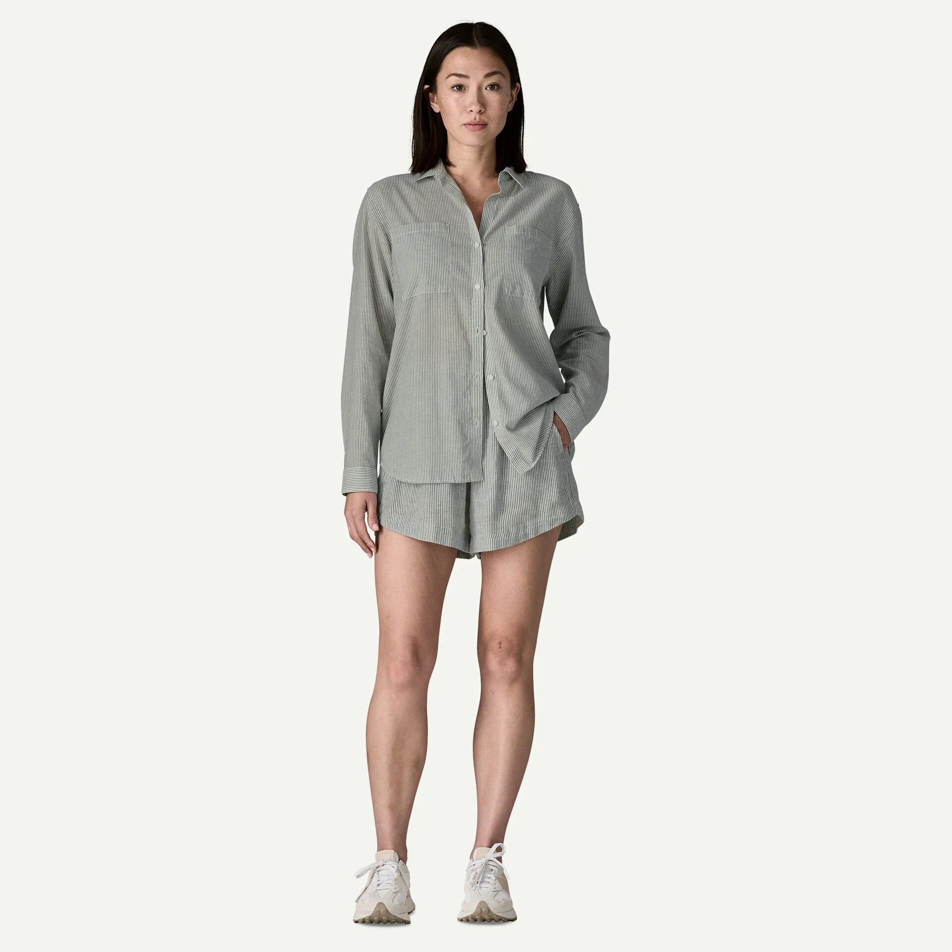 Gray striped button-down shirt and matching shorts set on model, front view