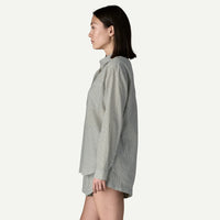 Gray striped button-down shirt shown from side profile on woman
