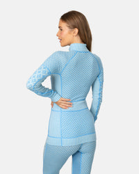 Women's long-sleeve half-zip base layer top with Nordic geometric pattern, back view on model