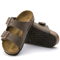 Brown leather sandals with two adjustable straps and textured sole, shown from side angle