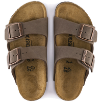 Brown two-strap sandals with buckles and cork footbed, top view showing both feet