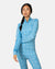 Women's half-zip base layer top with blue snowflake pattern, front view on model