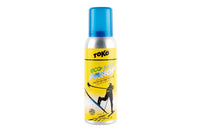 Ski care spray bottle with yellow label and blue cap, front product view
