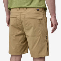 Khaki outdoor shorts with multiple pockets and zippered details, back view on model