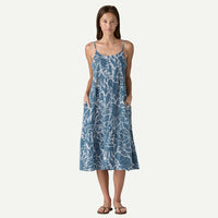 Blue patterned midi dress with thin straps and flowing swirl design, front view