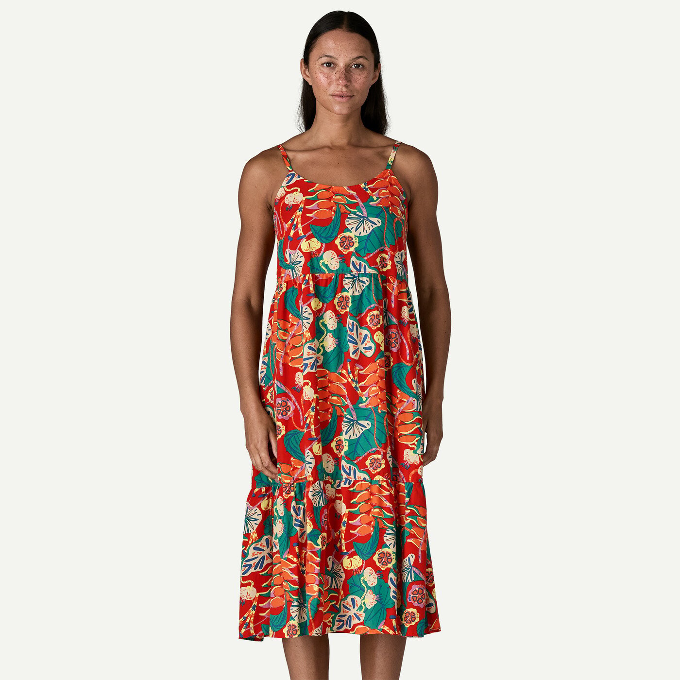 Sleeveless midi dress with tropical floral print featuring tiered ruffles at hem