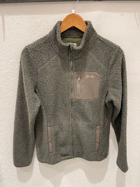 Olive green sherpa fleece jacket with full zip and chest pocket on wooden hanger