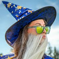 Reflective yellow-green sunglasses worn by person in wizard costume outdoors
