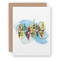Greeting card with watercolor kayaks in various colors on blue water background