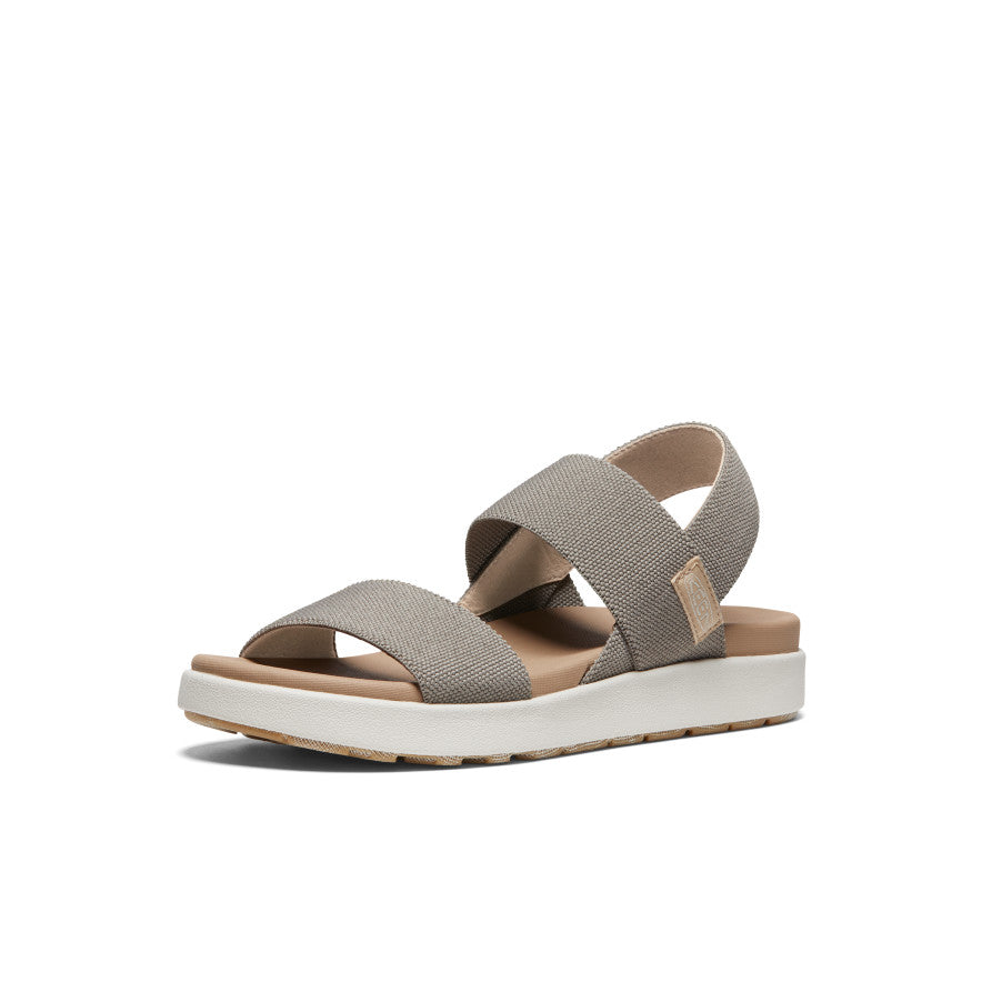 Women's sport sandal with gray fabric straps, white sole, and tan footbed