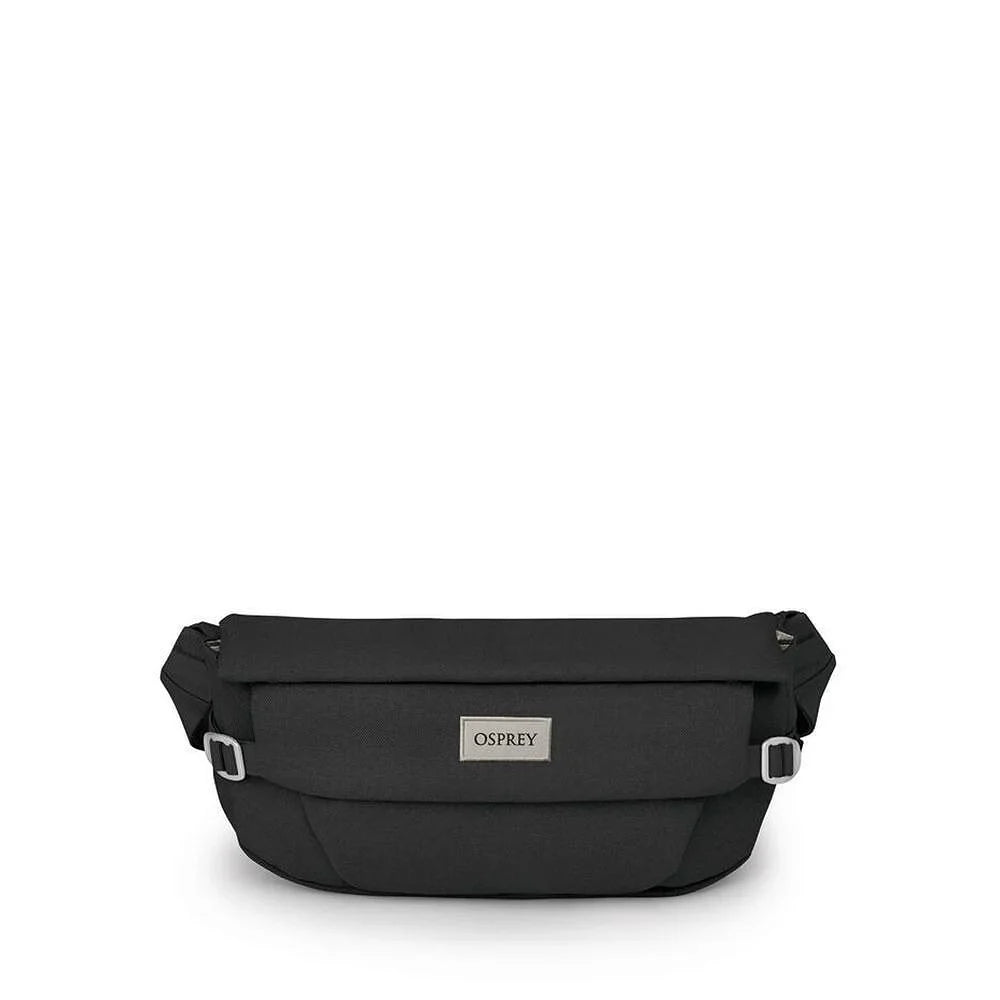 Black hip bag with roll-top flap, adjustable strap, and metal brand label, front view