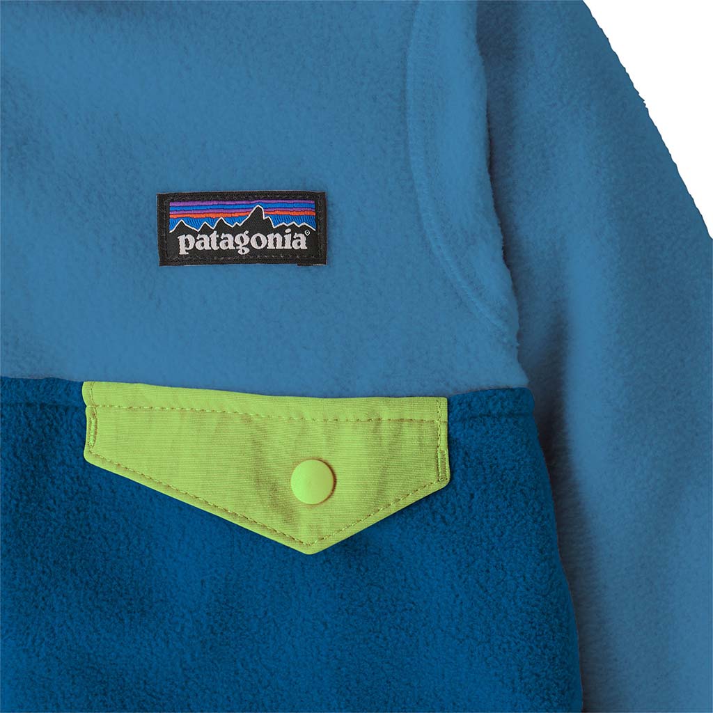Close-up detail of fleece jacket chest pocket with lime green flap and snap button closure