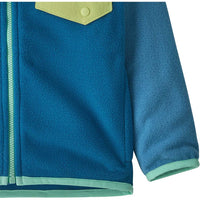 Close-up detail of baby fleece zip jacket showing chest pocket, snap button, and mint green trim