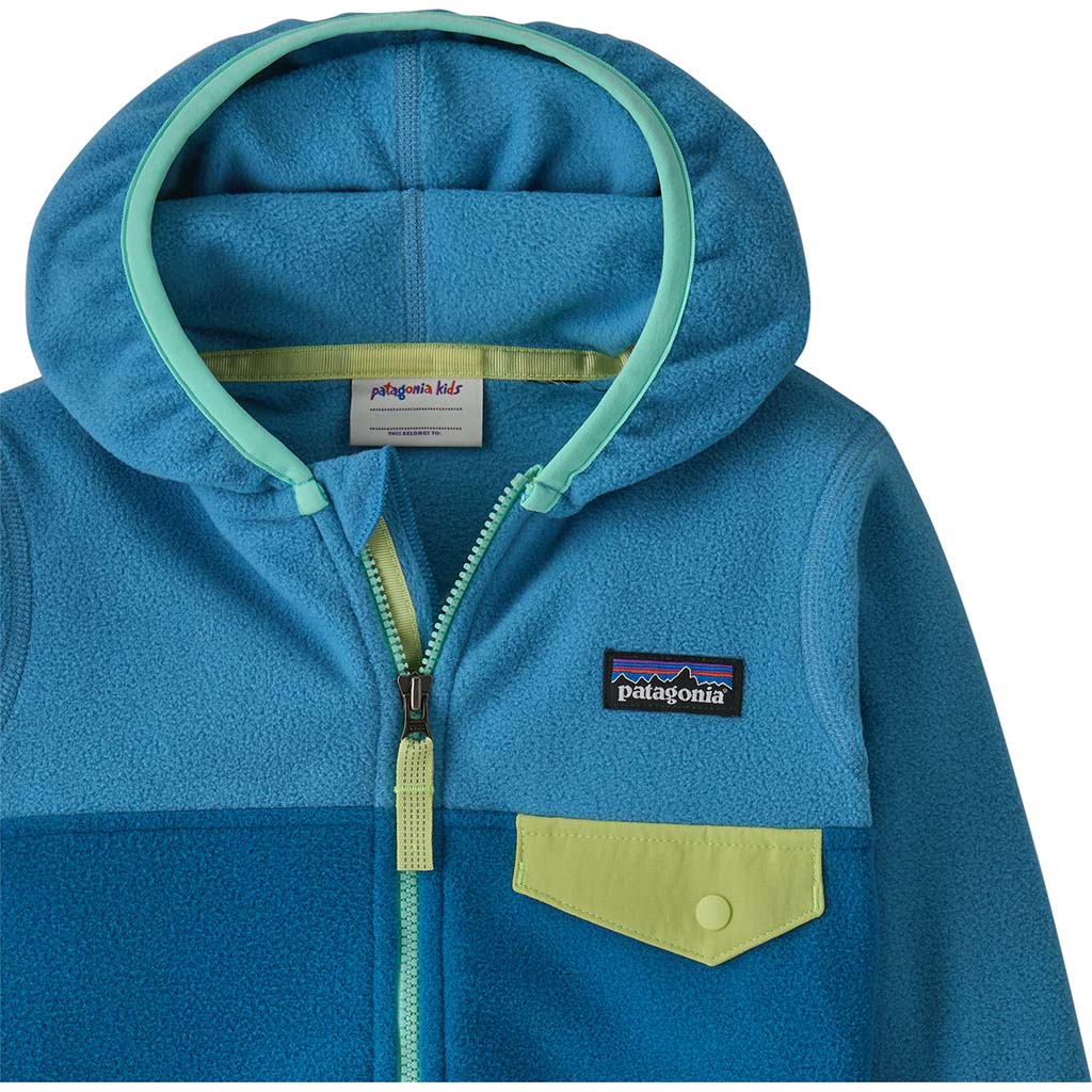 Baby fleece zip-up hoodie with snap chest pocket, two-tone blue colorblock and contrast zipper, close-up detail view