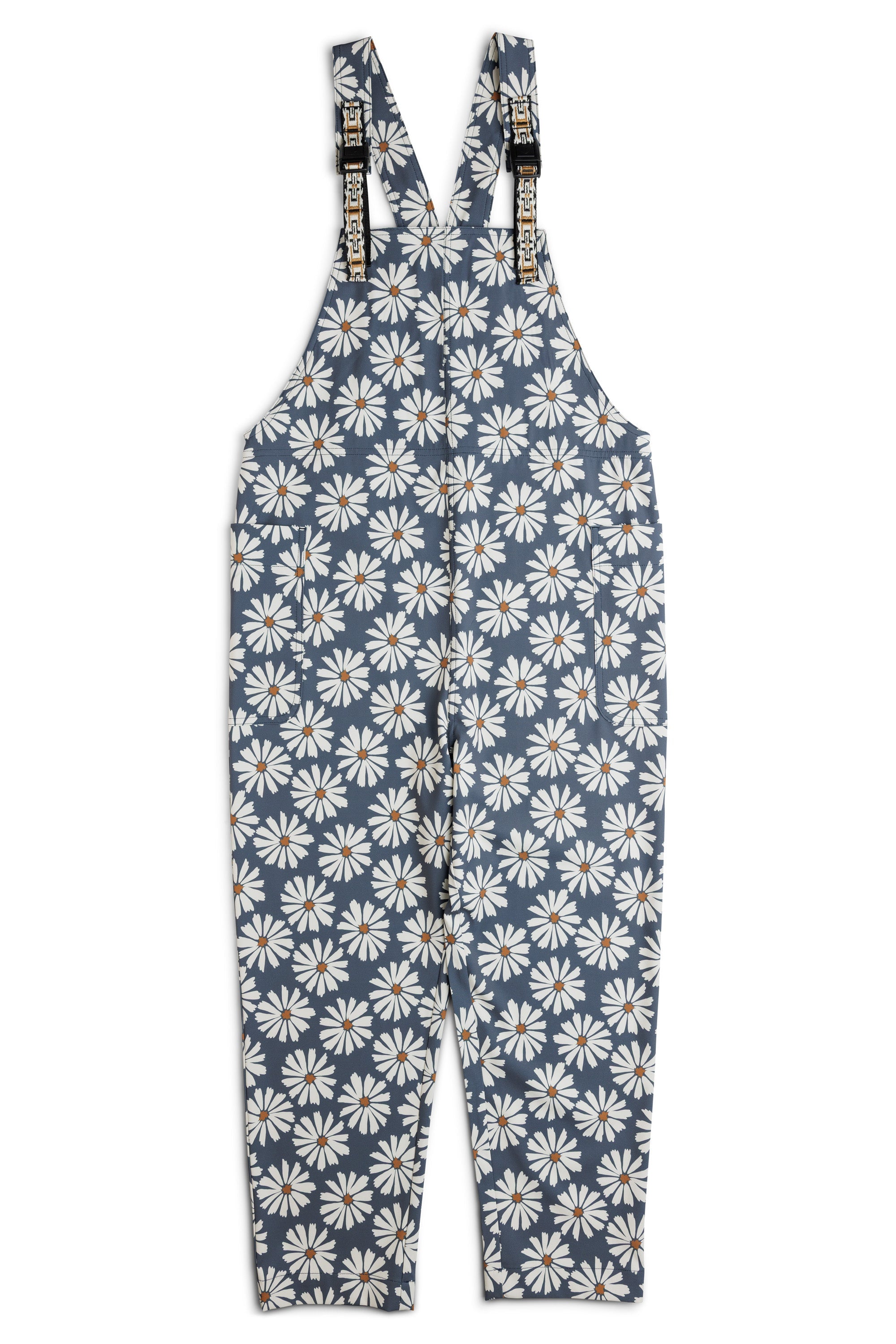 Blue overalls with white daisy floral pattern and adjustable straps, front view