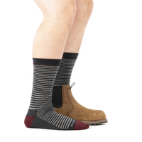Side view of striped crew socks in charcoal with burgundy toe, worn with brown Chelsea boot