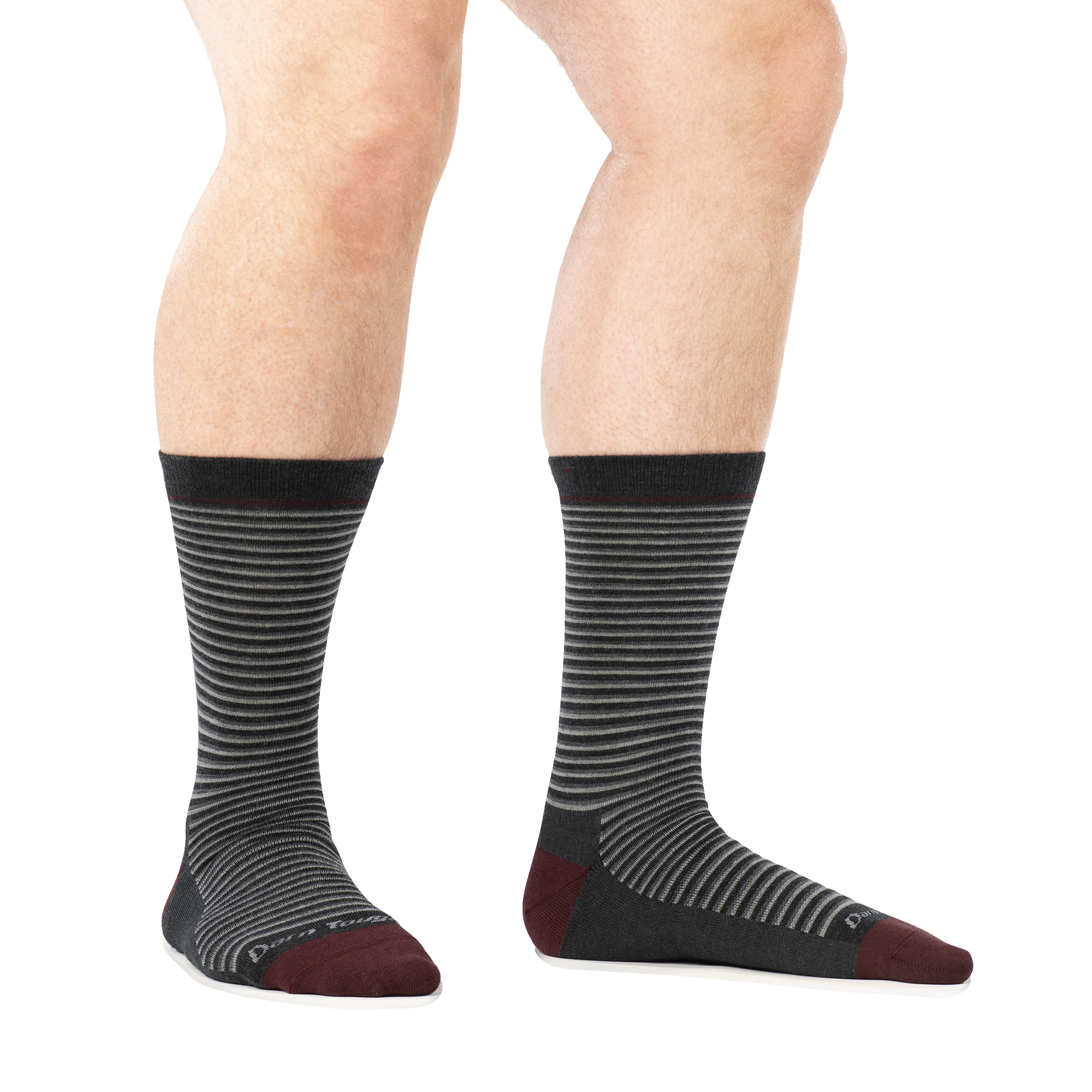 Crew-length striped dress socks with dark charcoal body and burgundy toe and heel, on-model side view