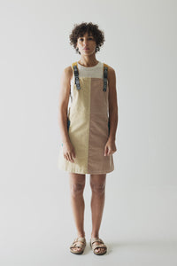 Colorblock jumper dress with decorative shoulder straps in tan and brown tones
