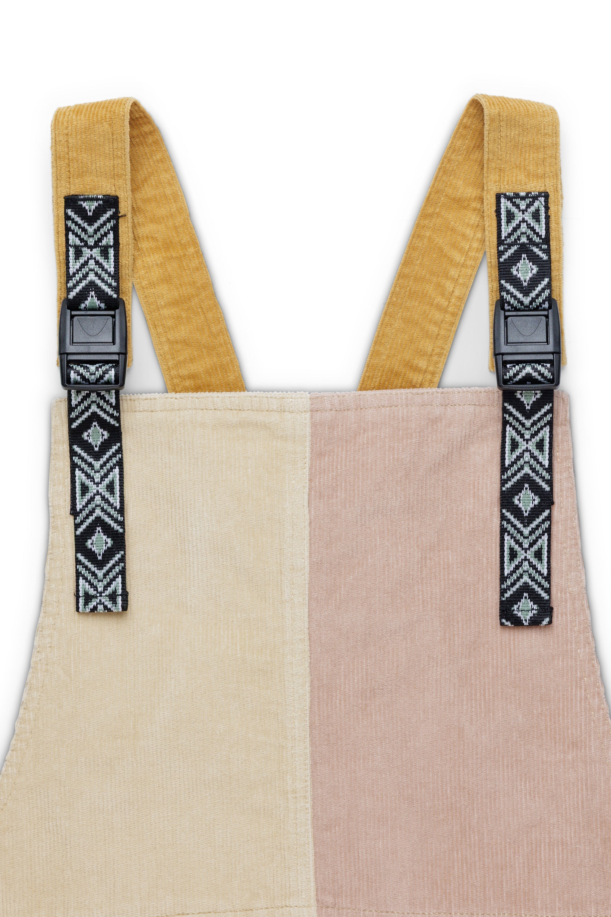 Color-blocked corduroy jumper dress with geometric patterned adjustable straps, front view