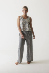 Gray corduroy wide-leg pants with elastic waistband worn by woman on white background