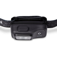 Compact headlamp with single LED lens, power button, and adjustable fabric headband, front angle view