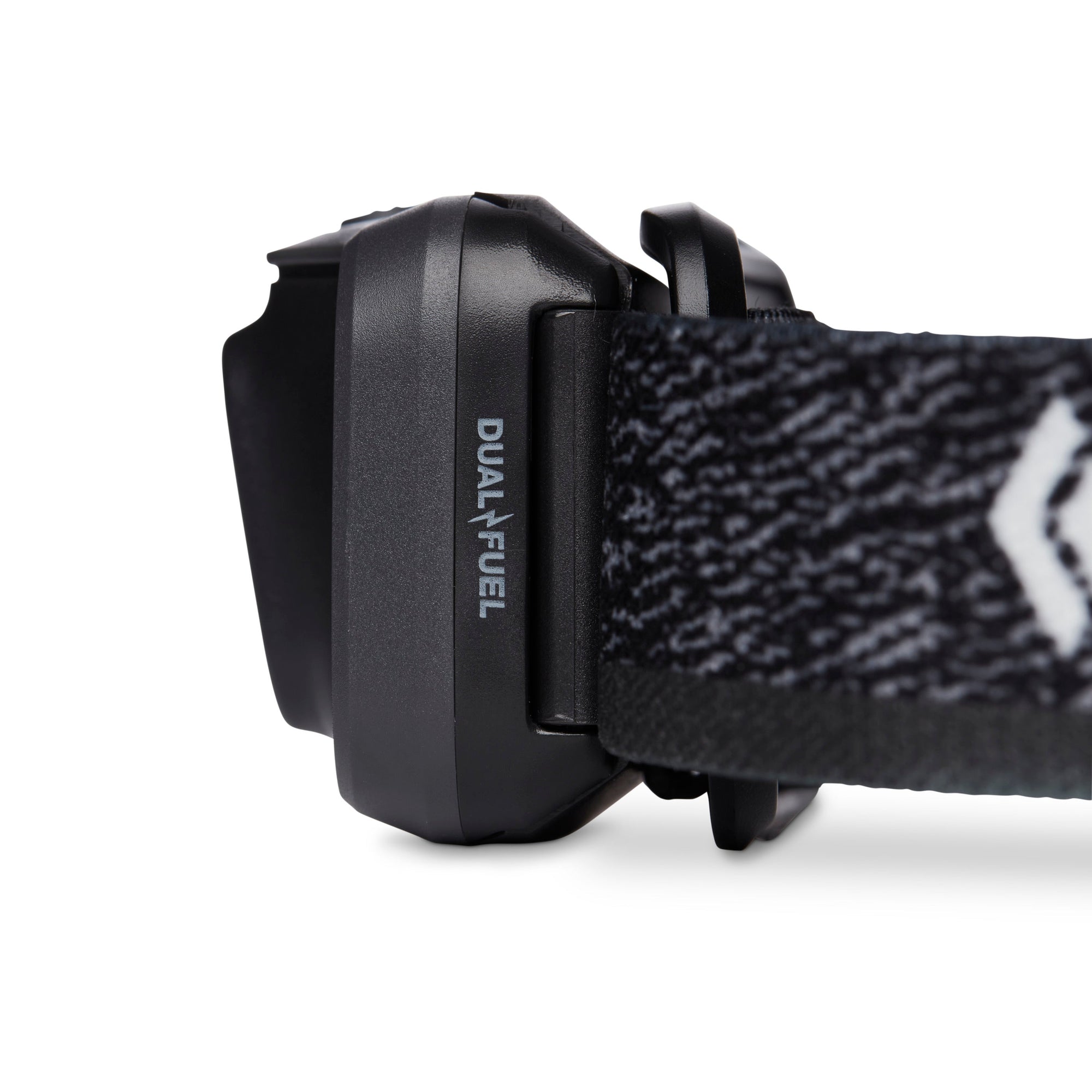 Close-up side view of headlamp battery pack with Dual Fuel label and patterned elastic strap