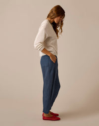 Blue patterned linen pants with relaxed fit and side pockets, worn with red flats