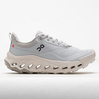 Light gray running shoe with cream sole and distinctive perforated midsole, side profile view
