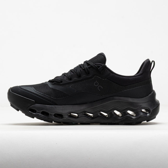 Black athletic running shoe with mesh upper and distinctive air-filled sole technology, side view
