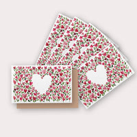 Greeting cards with pink and red heart-shaped flowers and green leaves pattern