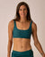Teal sports bra with scoop neckline and matching high-waisted leggings, front view