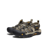 Dark gray sport sandals with protective toe caps and adjustable straps, three-quarter view