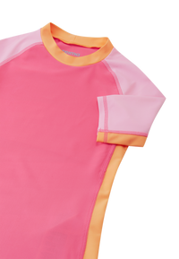 Colorblock short-sleeve rash guard with pink panels and orange trim, detail view