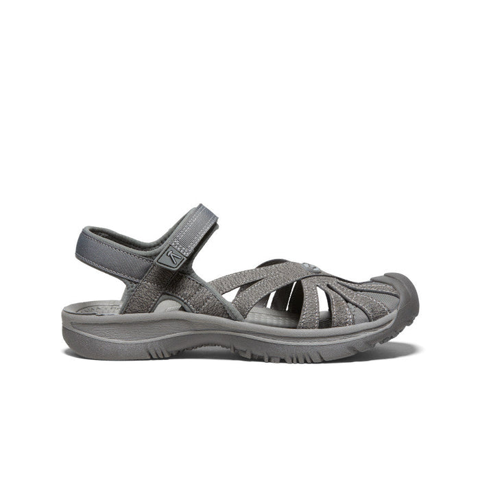 Gray outdoor sandal with adjustable ankle strap and textured toe protection, side view