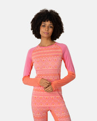 Women's long sleeve base layer top with geometric pattern, pink and coral colorblock raglan sleeves, front view
