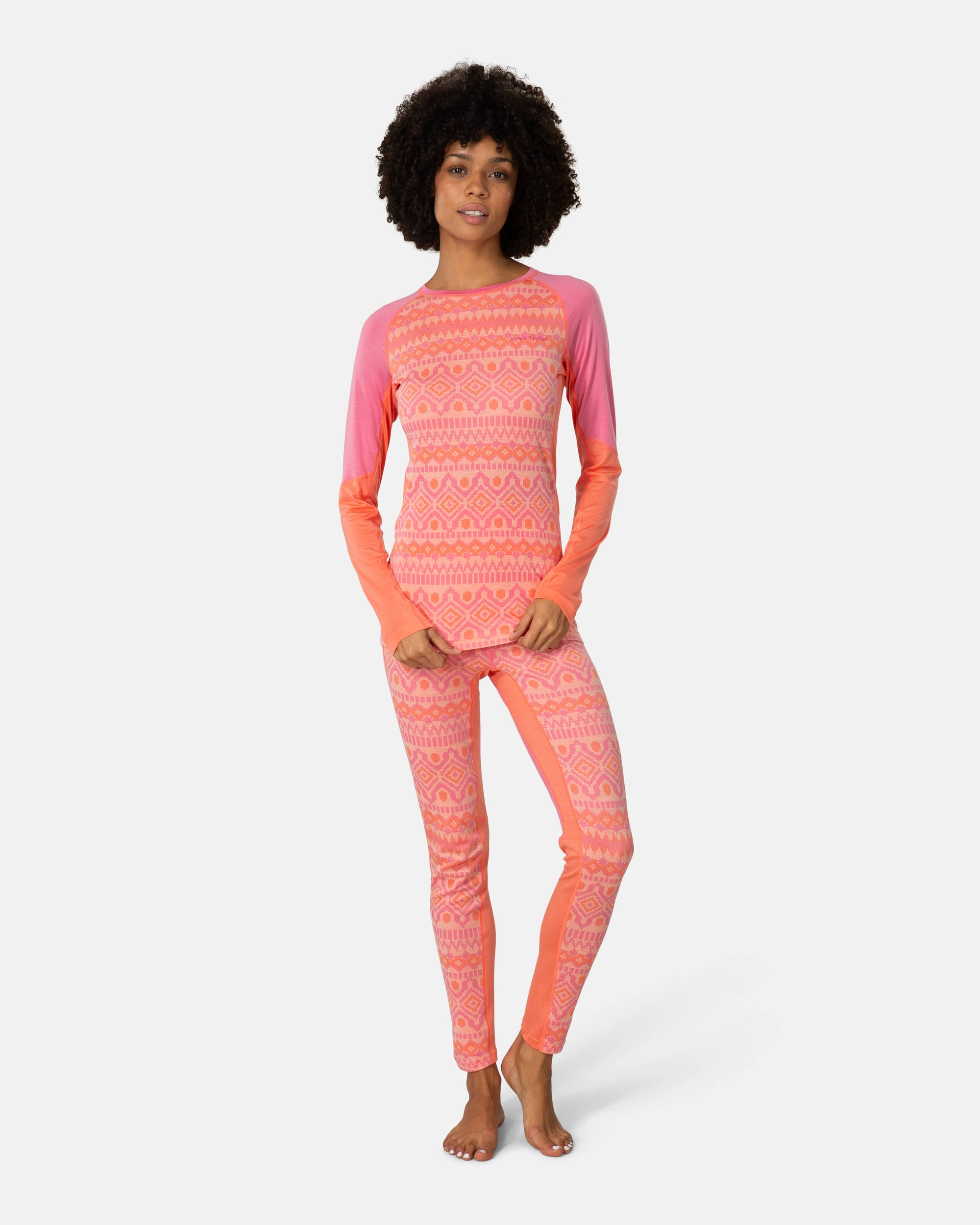 Women's long sleeve base layer top with geometric fair isle print, pink and coral colorblock, front view