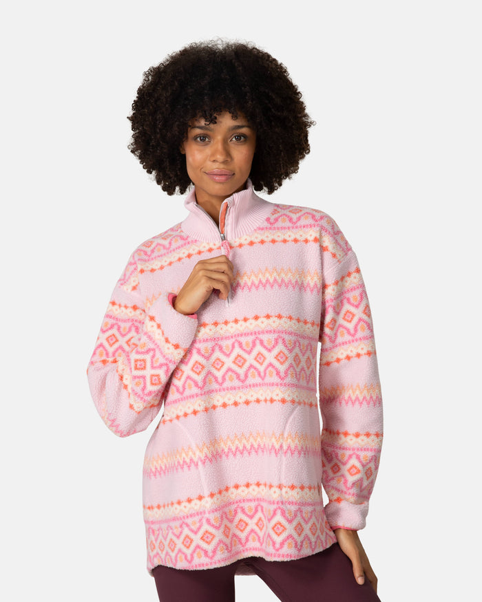 Women's sherpa fleece half-zip pullover with Fair Isle pattern in pink tones, front view on model