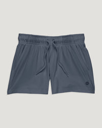 Youth athletic shorts in slate blue-gray with elastic drawstring waist and side pockets, front view