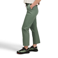 Women's outdoor pants in sage green with drawstring waist and side pockets, side view