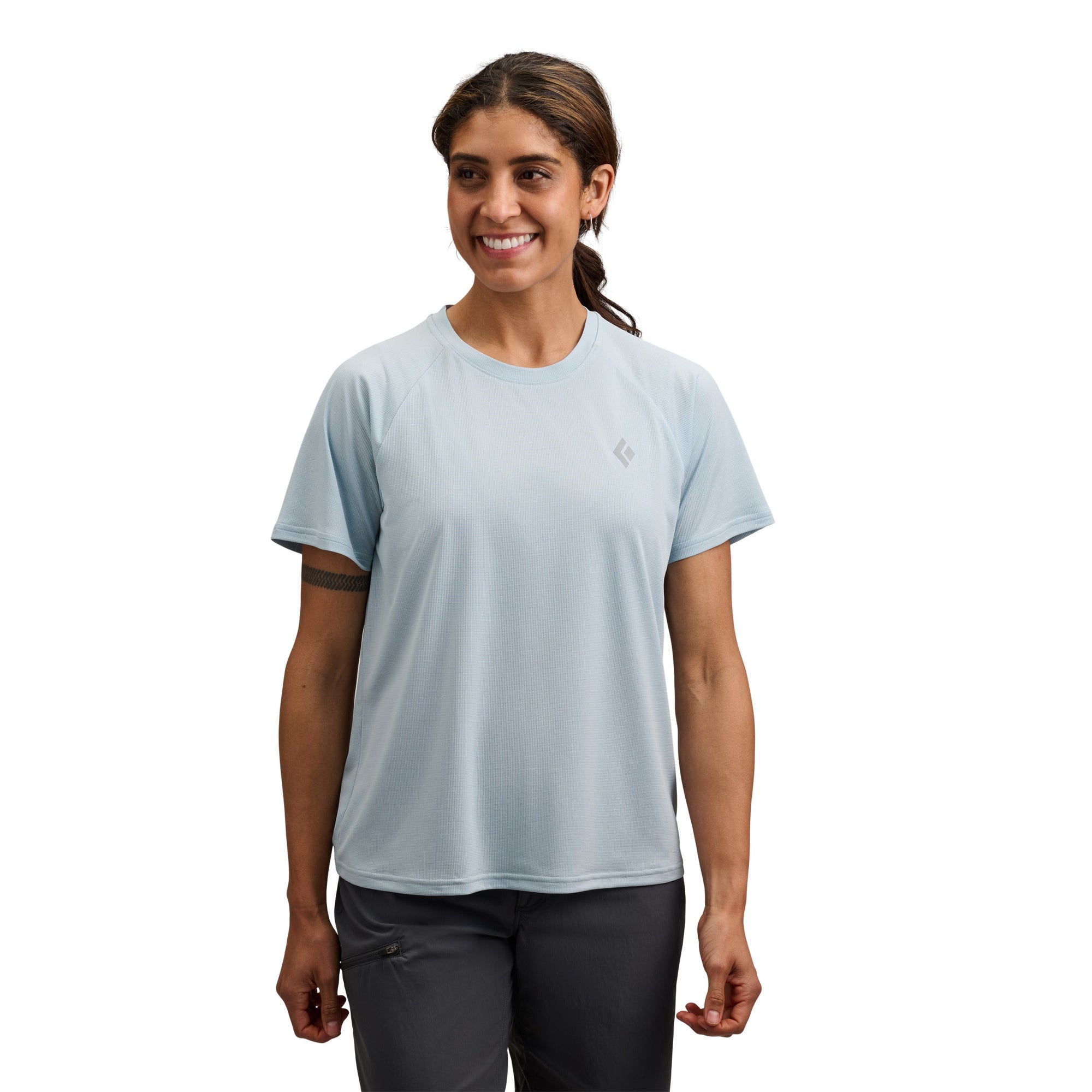Light blue athletic short sleeve tee with crew neck on smiling woman