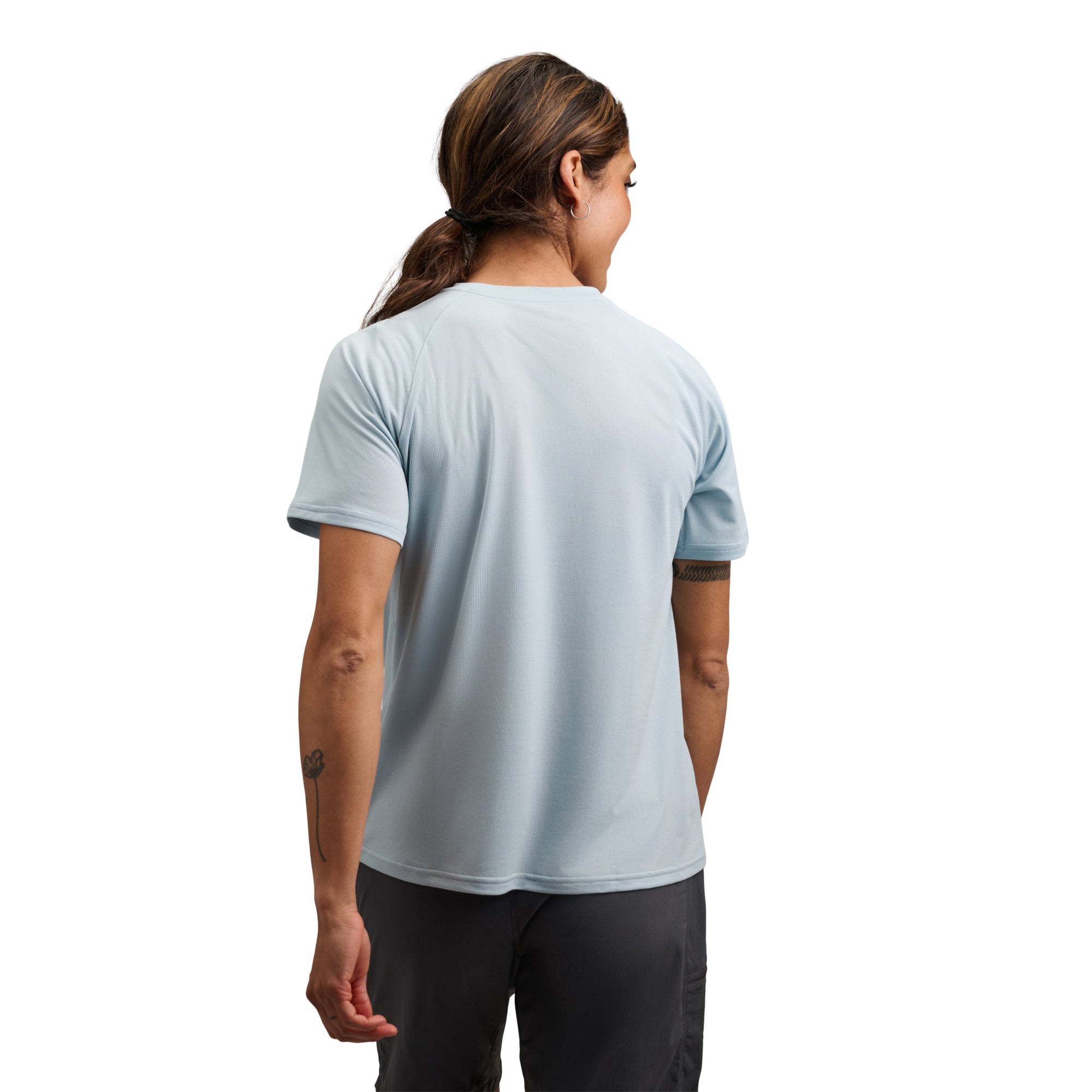 Light blue short sleeve athletic tee shirt shown from back view on model