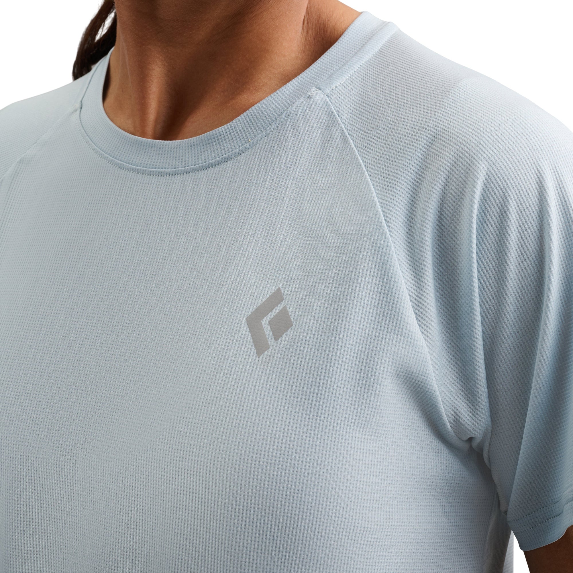 Light blue short sleeve athletic tee with crew neck and small logo on chest
