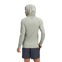 Light green hooded athletic top shown from back, worn with navy shorts