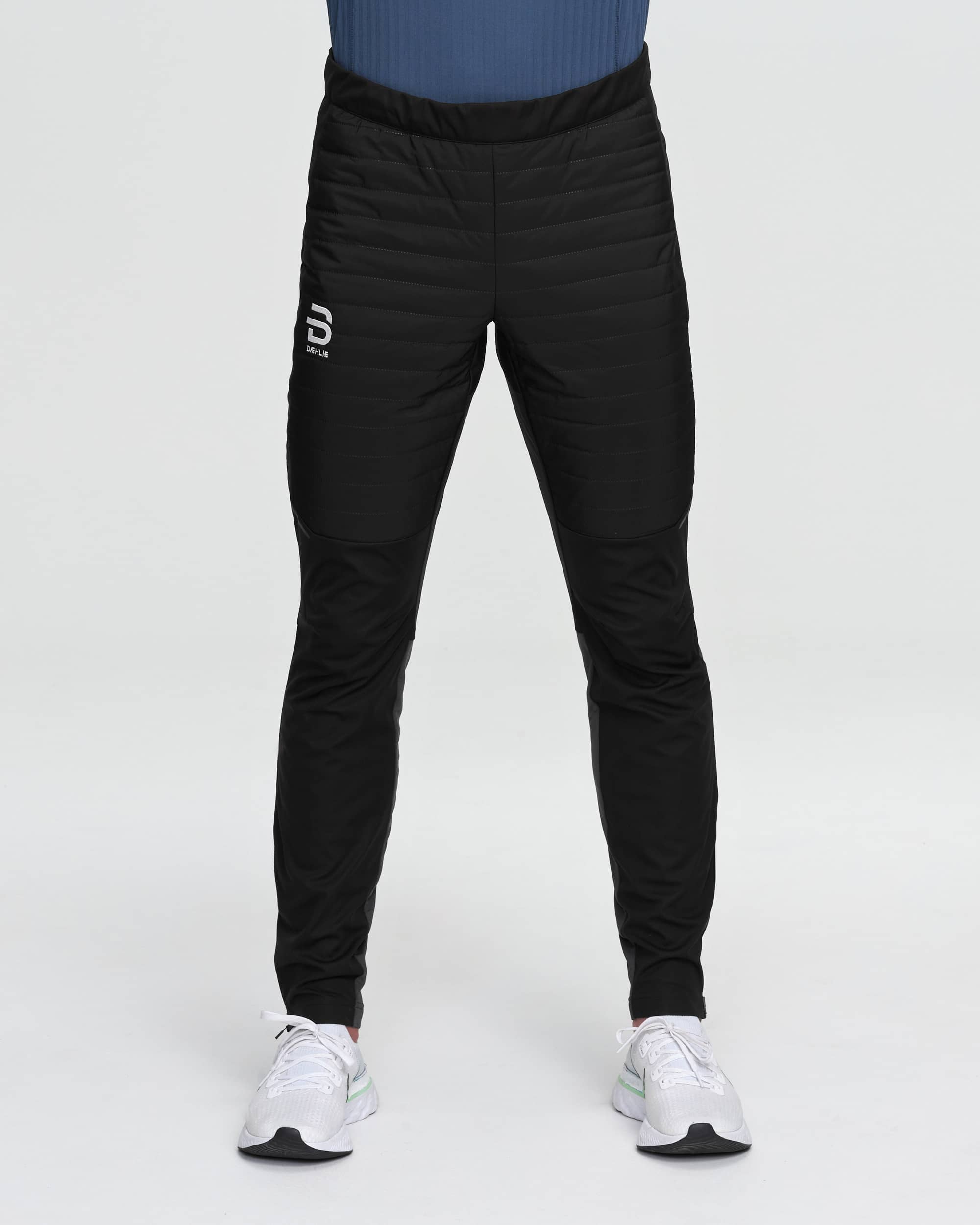 Black insulated slim-fit athletic pants with quilted front panels, front view on model