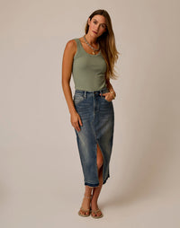 Sage green ribbed tank top worn with denim skirt, front view