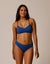 Royal blue bikini bottom with fold-over waistband on model, front view