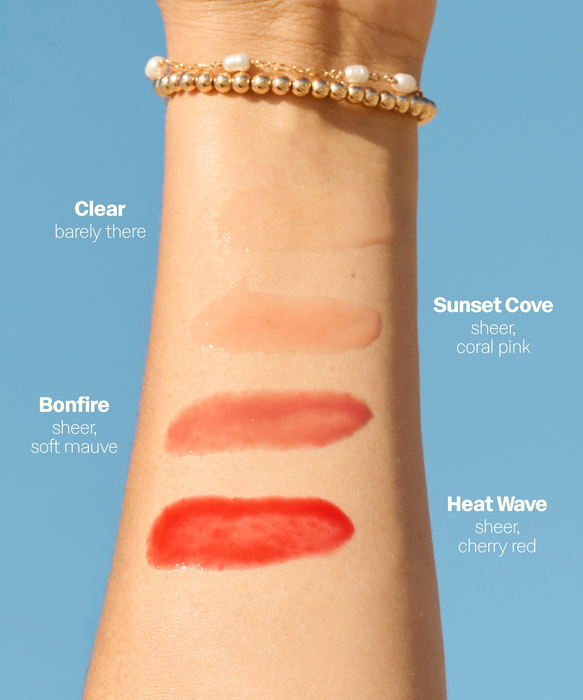 Arm swatch showing four tinted lip balm shades from clear to cherry red on skin