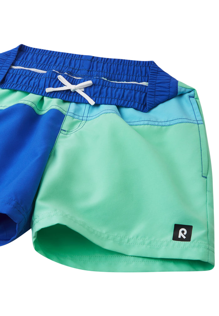 Children's swim shorts with blue and green colorblock design, elastic waistband and drawstring